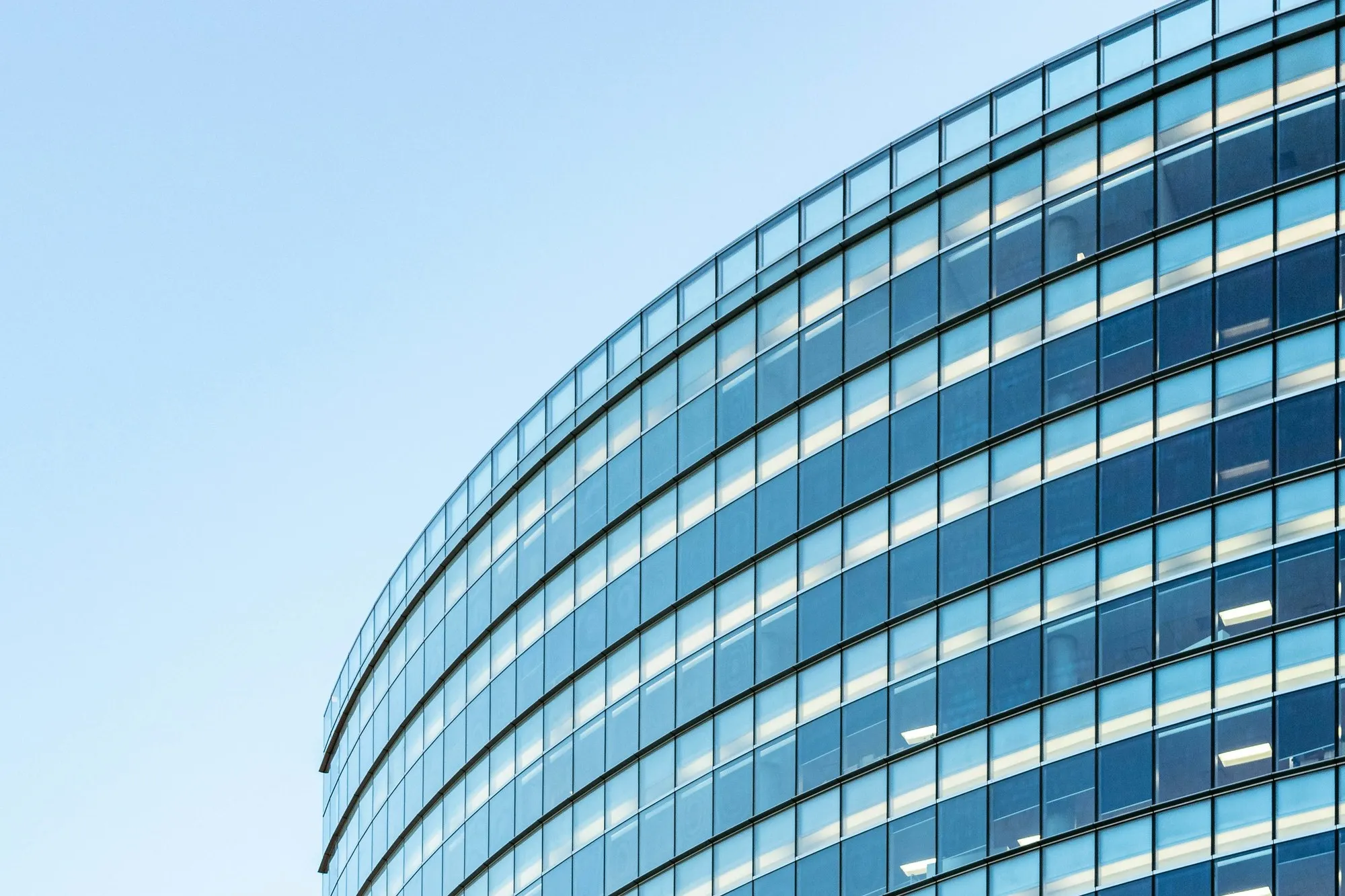Curved glazed curtain-wall facade of a modern office building