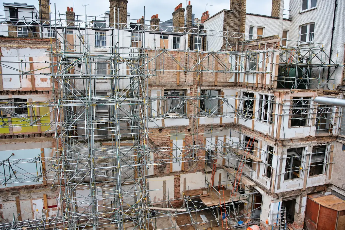 Gutted London building held by a façade-retention scaffold during redevelopment