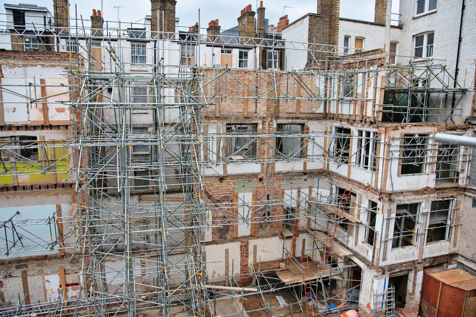 Building behind a facade-retention scaffold in London