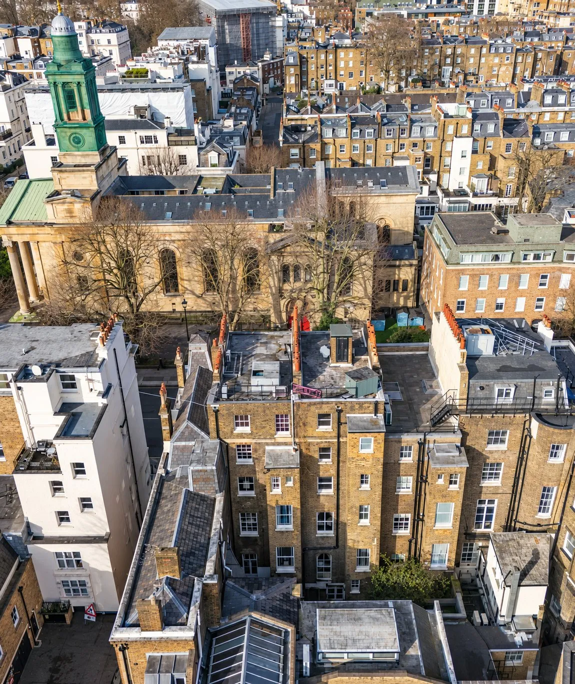 Drone view of rear gardens and backland behind a London terrace