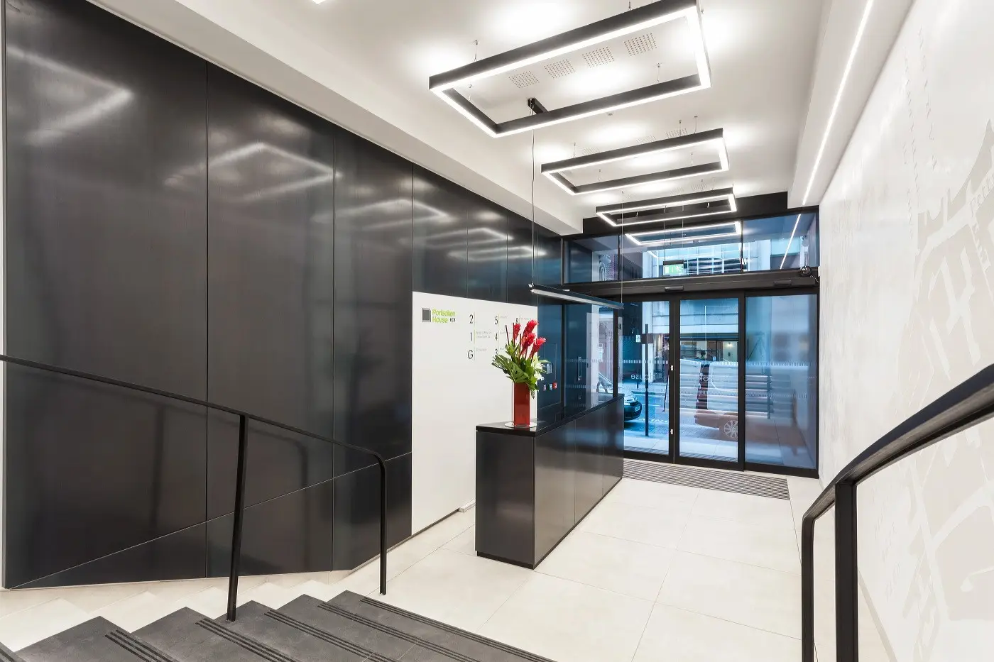 Finished reception at Portsoken House in Aldgate, rebuilt by Craftex with new wall panels and lighting