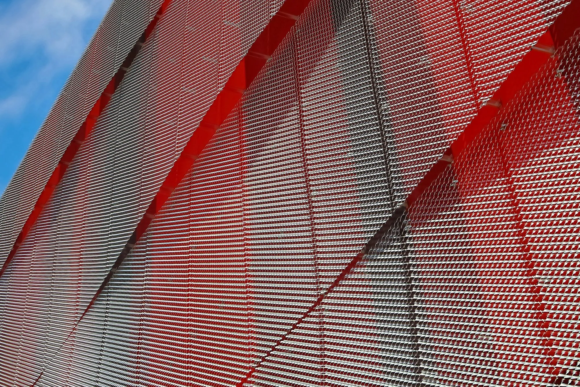 Perforated metal cladding panels on a building facade