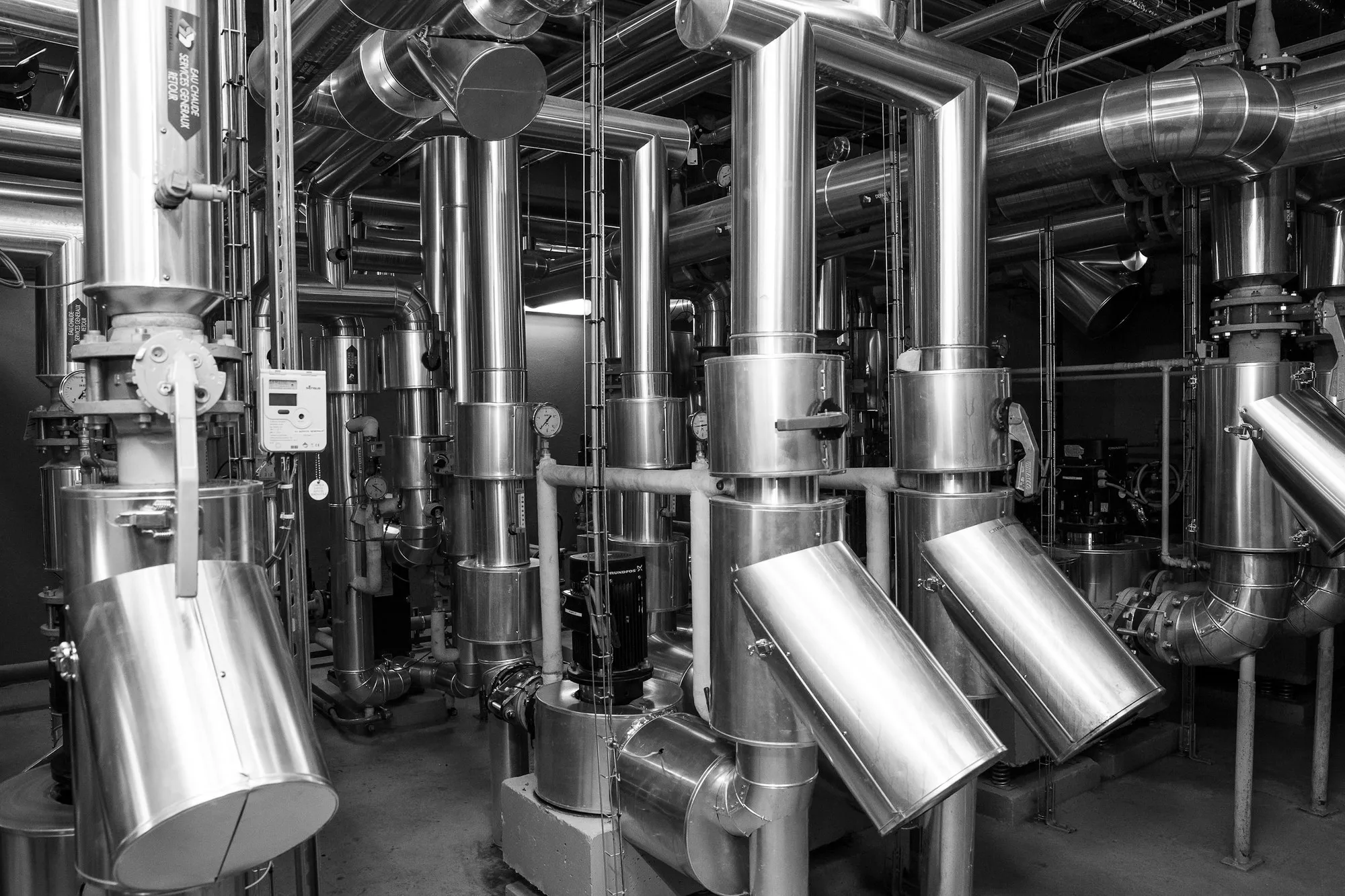 Stainless steel insulated pipework and valves in a plant space
