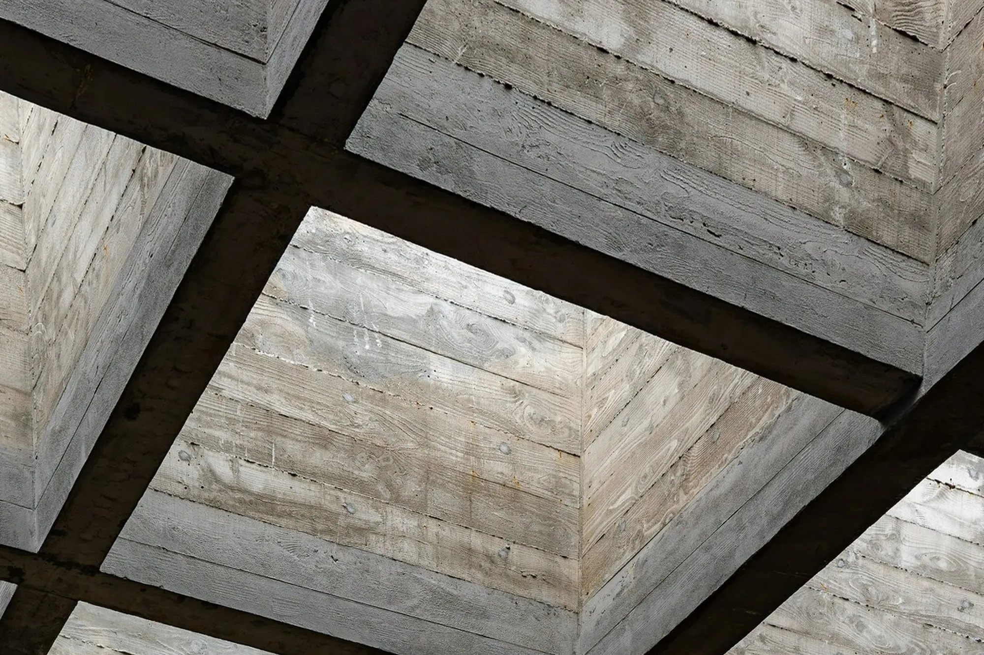 Exposed concrete waffle slab soffit with deep coffers