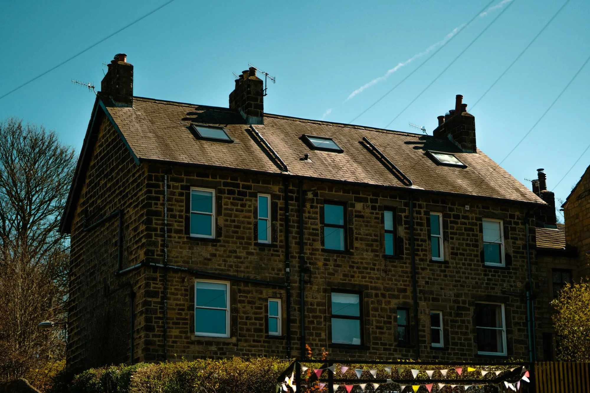 Period brick house with a pitched slate roof