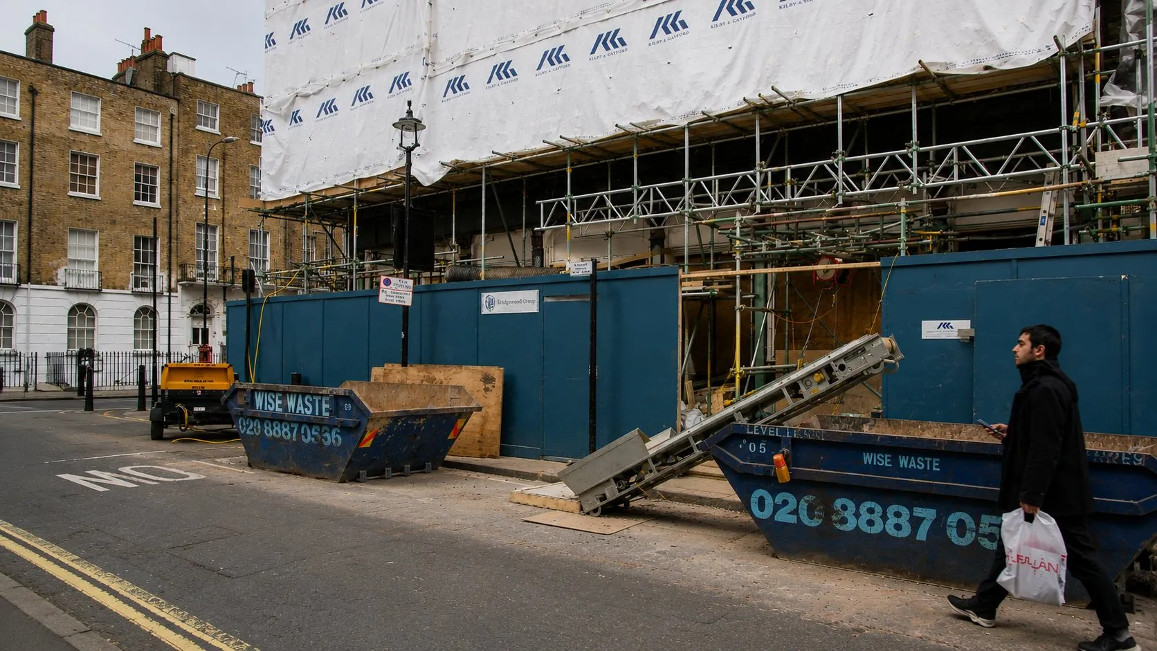 Hoarding, skips and site logistics on a live London construction site