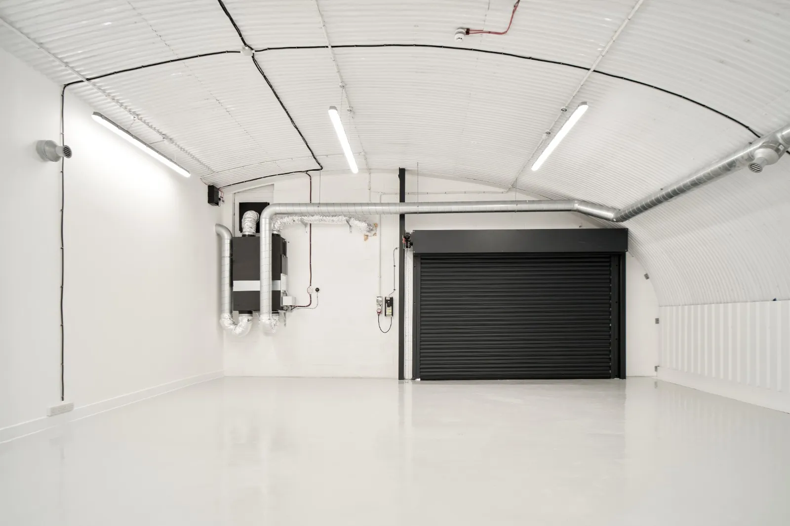 Railway-arch storage and dispatch space with roller shutter, Drake's