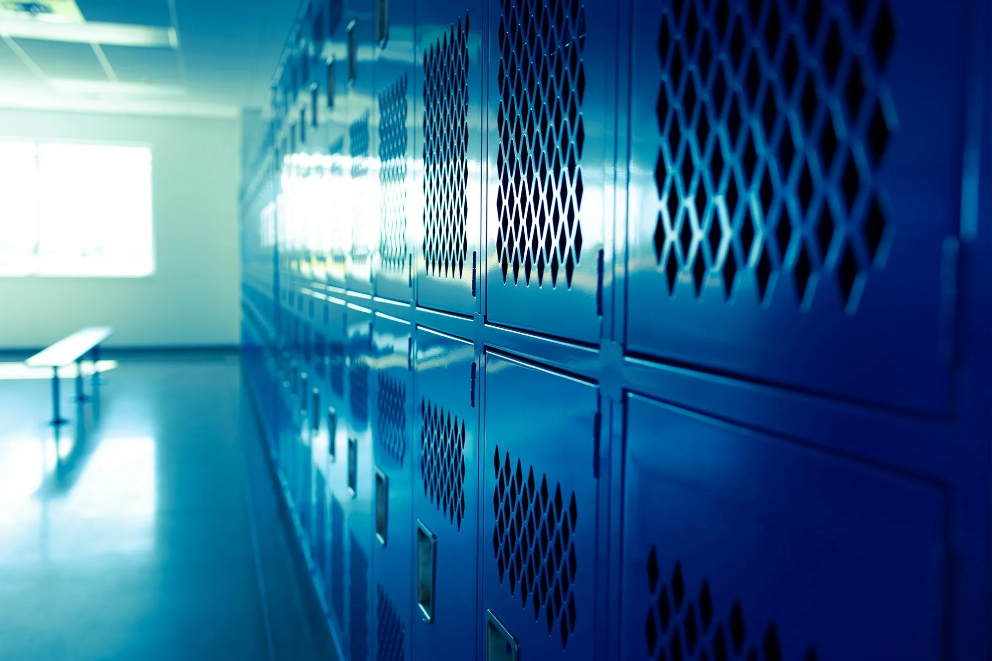 Row of blue lockers in a bright changing room