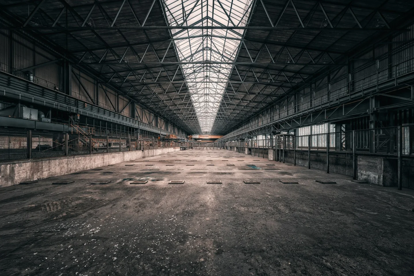 Vast industrial hall with roof lights, ready for refurbishment in Surrey
