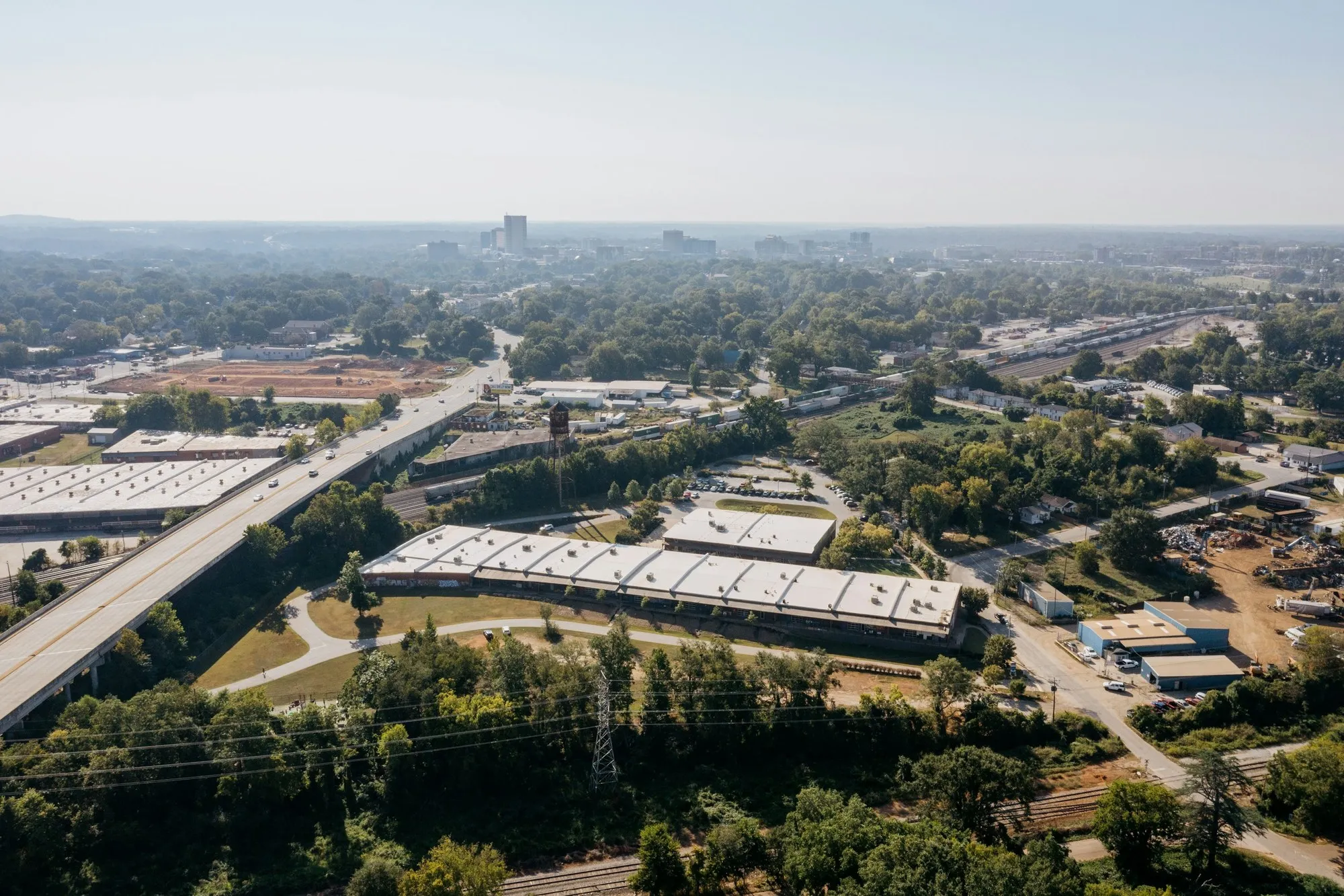 Aerial view of industrial units among trees, typical of Surrey business parks